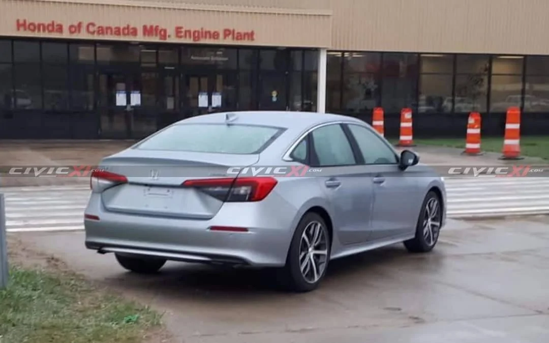 11th Gen Honda Civic 2022 Silver Civic Touring posing outside production plant 2022 Honda Civic Sedan Silver 2 CivicXI.com