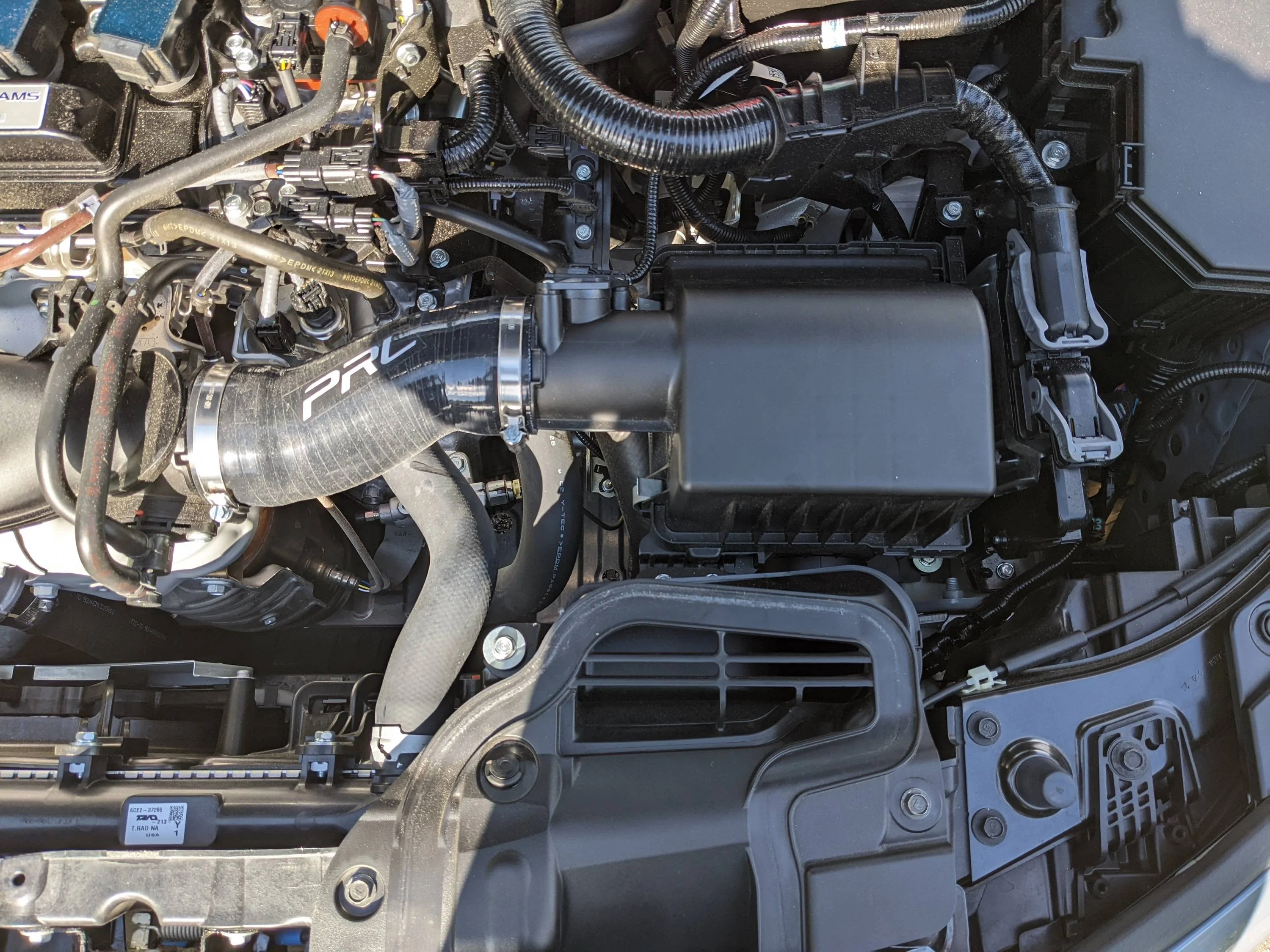 11th Gen Honda Civic Sprint P08 air filter, and PRL silicon intake hose installed. YUSNbs6